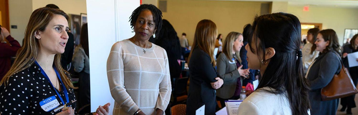 people speaking at a career fair