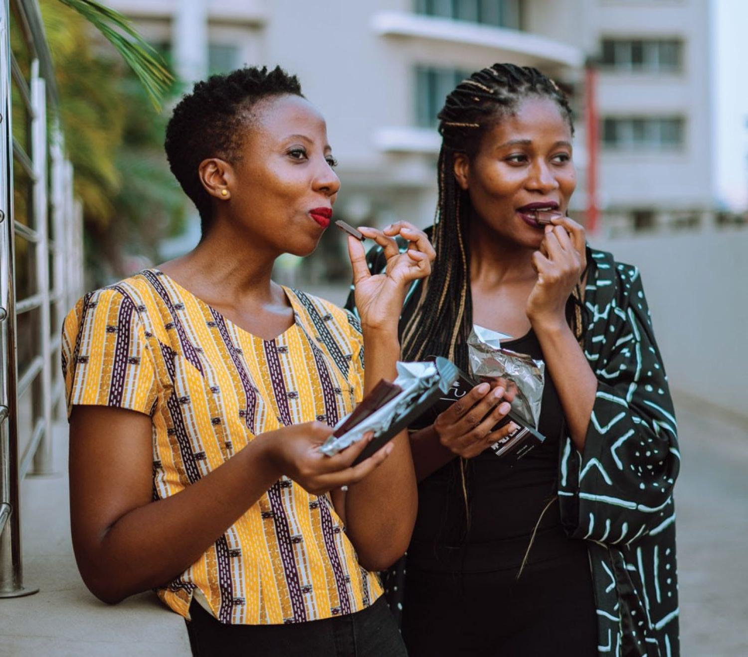 Photo of Priscilla and Kimberly Addison enjoying their chocolates