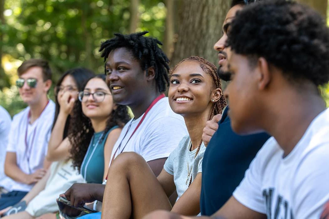 Several Messina College students sitting in a group during their orientation.