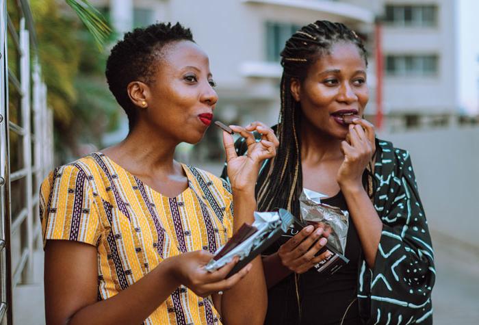 Photo of Priscilla and Kimberly Addison enjoying their chocolates